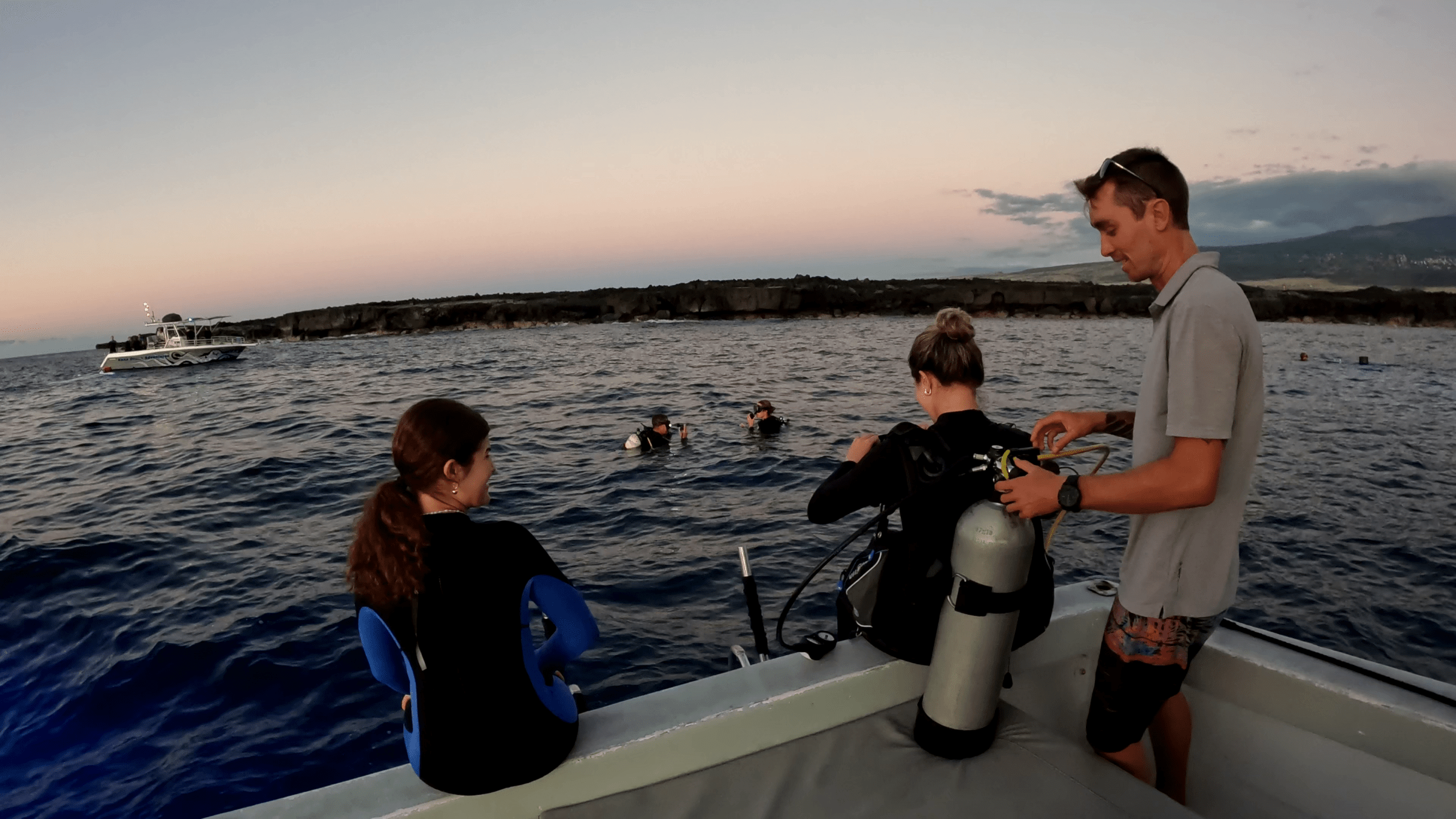 Captain Conner helping our guests with their 1-tank scuba gear, prepping for a night dive with Kona Ocean Adventures.